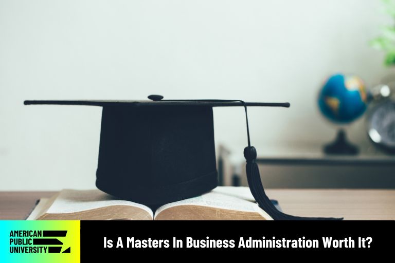 masters in business administration text book with graduation cap