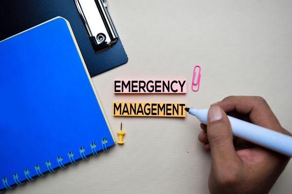 emergency management written on sticky note