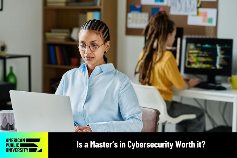 is-a-masters-in-cybersecurity-worth-it masters in cybersecurity student with laptop